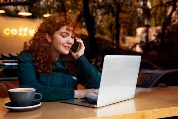 Woman working from cafe